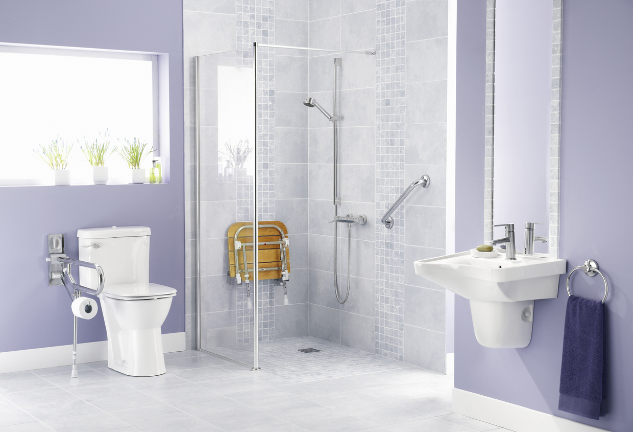 Bathroom stool in shower in adaptive housing bathroom